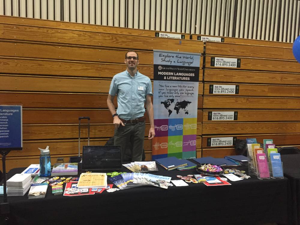 Professor Linford in front of Modern Languages table at Laker Experience Day